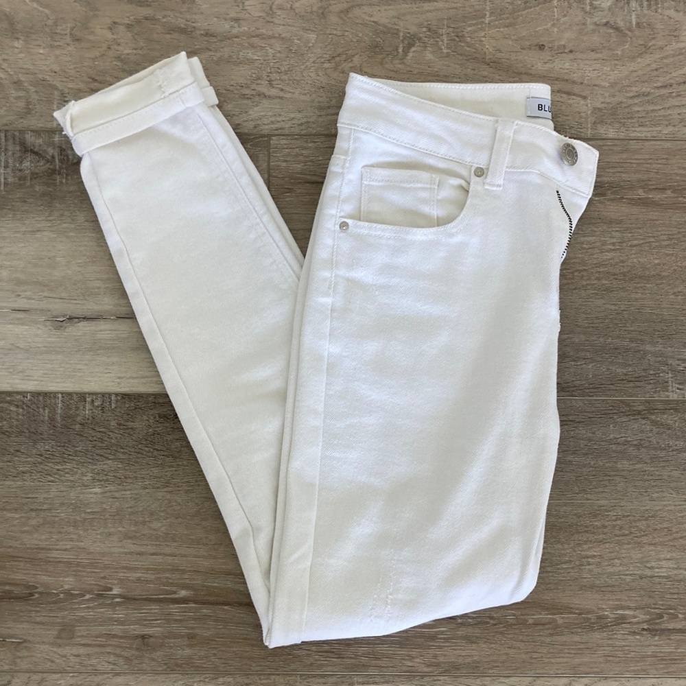 Blue Savvy white jeans with two small rips. Womens size 7/28.